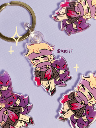 An array of keychains showing Gym Leader Morty and Gengar.